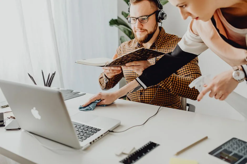 person-in-blue-long-sleeve-shirt-sitting-beside-black-laptop-computer-9gpkrsbgmc
